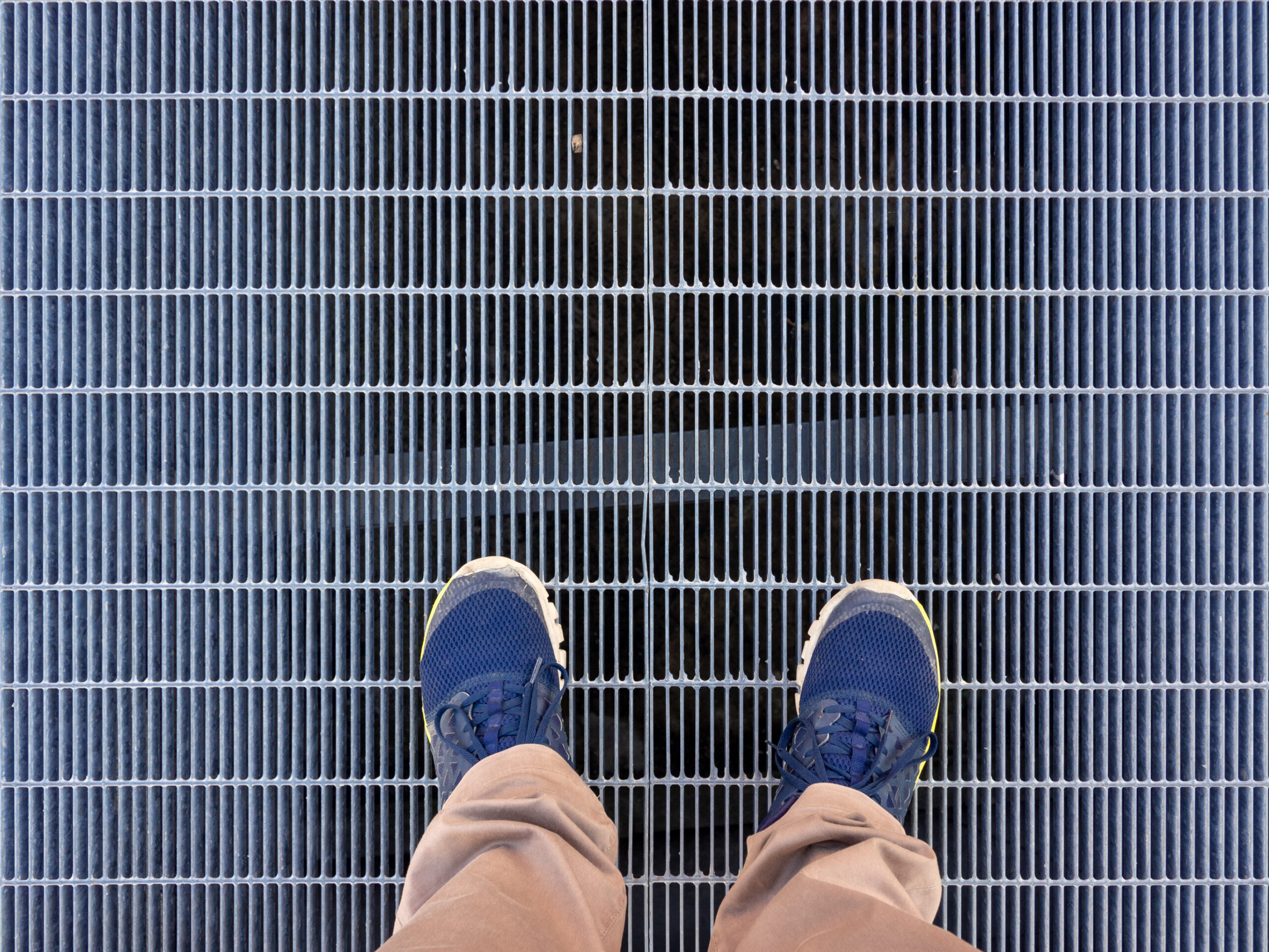 Someone standing on steel grating