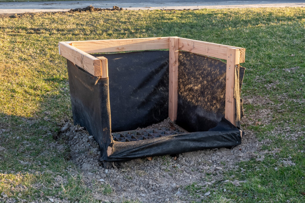 Temporary fence protection around a storm inlet on a construction site