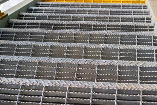 Metal grate stairs. Industrial architecture detail. Safety flooring